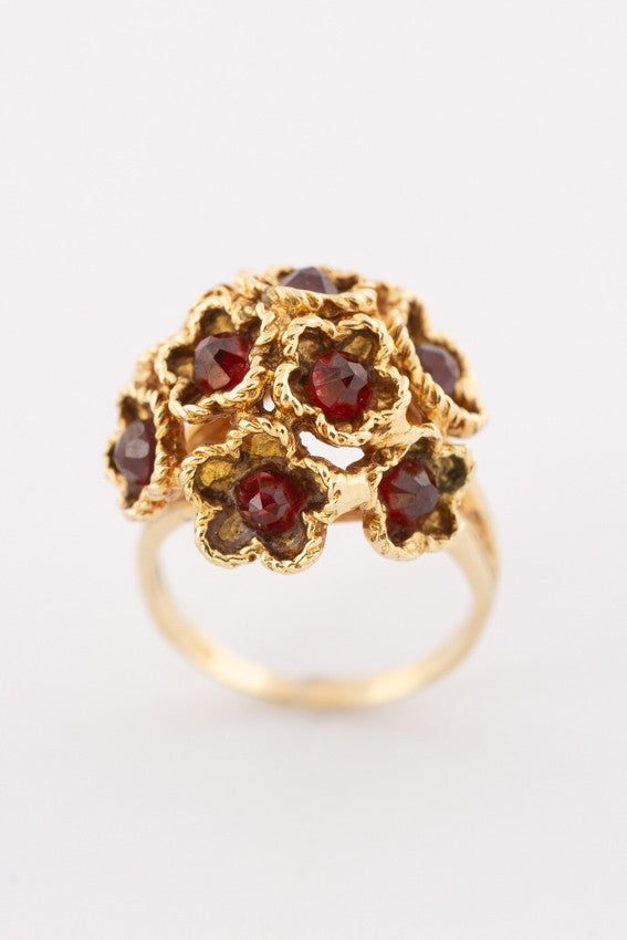 Gold cocktail ring with garnets