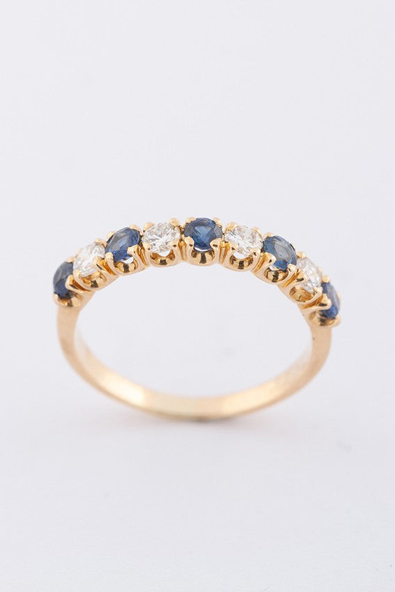 Gouden rij ring met 5 saffieren en 4 briljanten