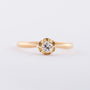 Gold solitaire ring with an old-cut brilliant of approx. 0.20 ct.