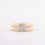 Gold row ring with oval and round cut diamonds