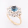 White/yellow gold entourage ring with topaz and diamonds