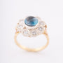 White/yellow gold entourage ring with topaz and diamonds