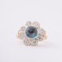 White/yellow gold entourage ring with topaz and diamonds
