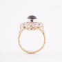 White/yellow gold entourage ring with topaz and diamonds