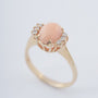 Gold ring with "angel skin" blood coral and diamonds