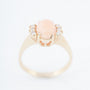 Gold ring with "angel skin" blood coral and diamonds