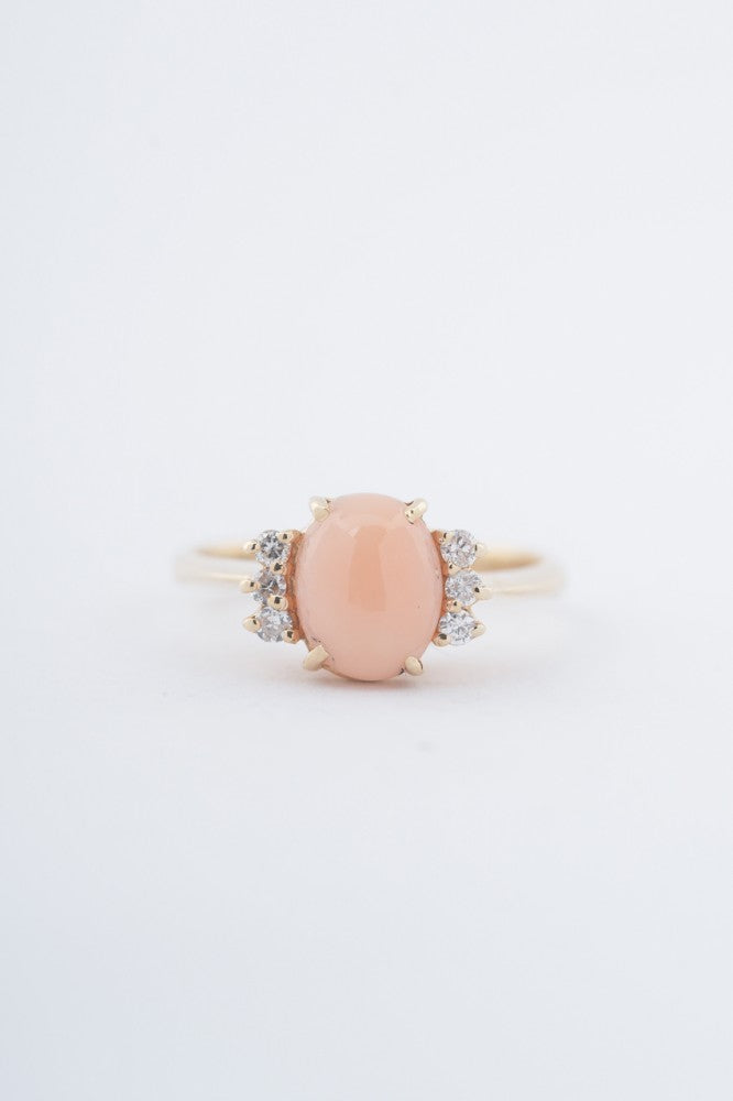 Gold ring with "angel skin" blood coral and diamonds