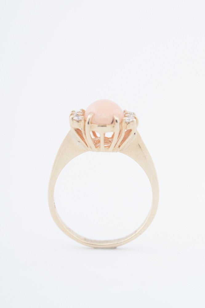 Gold ring with "angel skin" blood coral and diamonds