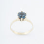 Gouden solitair ring met een london blue topaas