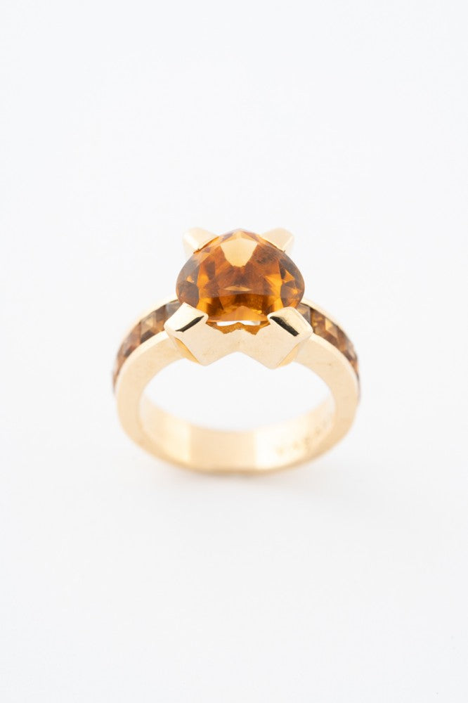 Gold ring with citrines, with a heart-cut citrine in the middle