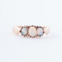 Gold row ring with 3 opals