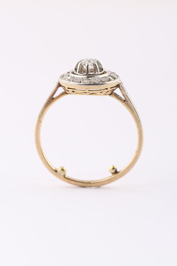 Gold entourage ring with old-cut brilliant and diamond