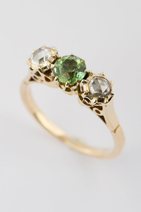 Antique gold row ring with peridot and rose diamond