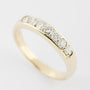 Gold row ring with 7 diamonds