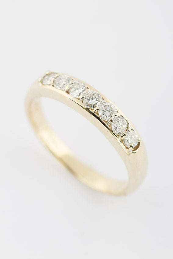 Gold row ring with 7 diamonds