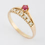 Gold row ring with ruby ​​and brilliant