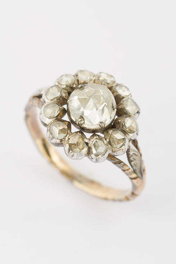 Gold entourage ring with rose-cut diamond
