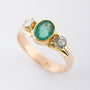 Gold ring with emerald and 2 diamonds