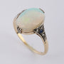 Crystal opal in gold ring