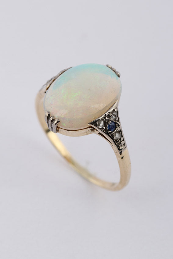 Crystal opal in gold ring