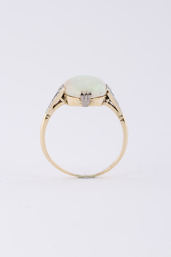 Crystal opal in gold ring