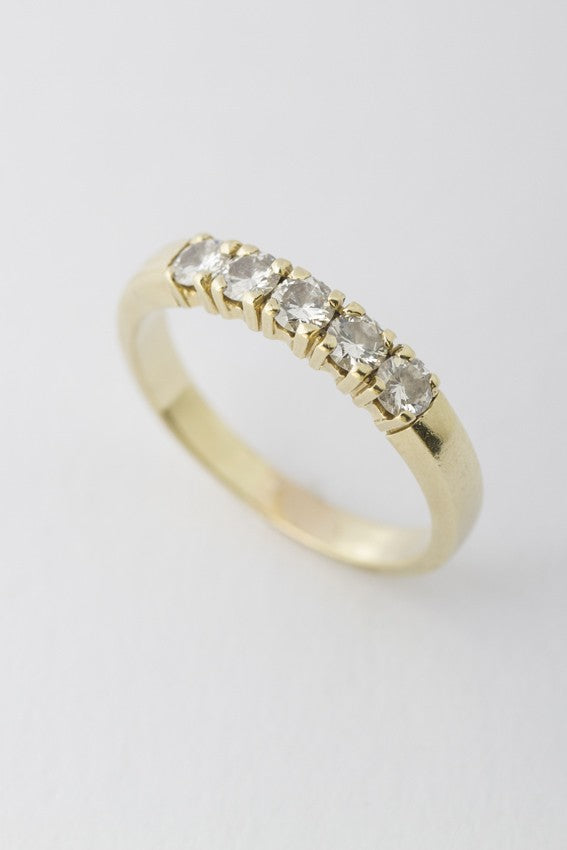 Gold row ring with 5 diamonds