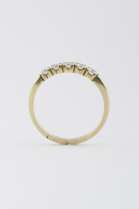 Gold row ring with 5 diamonds