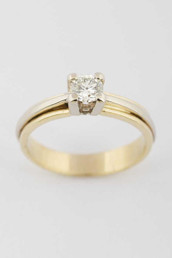 Wit/geel gouden solitair ring met briljant 0.61 ct.