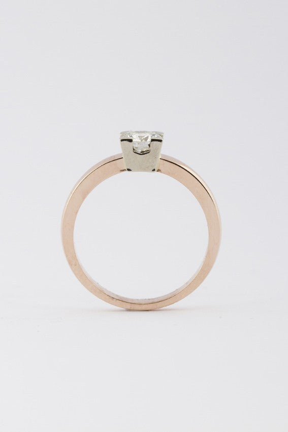 White/rose gold solitaire ring with 0.46 ct brilliant cut diamond.