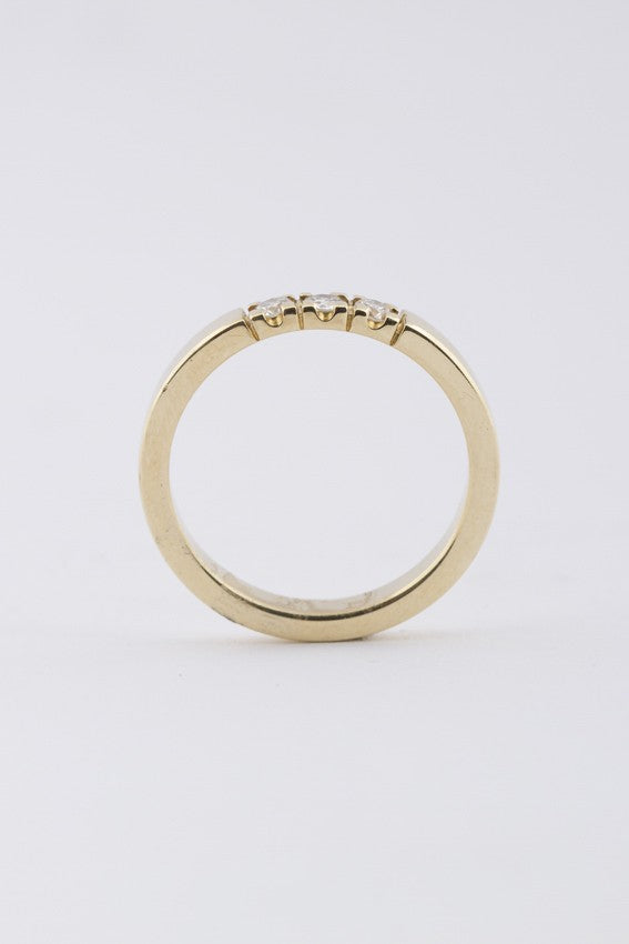 Gold row ring with diamonds