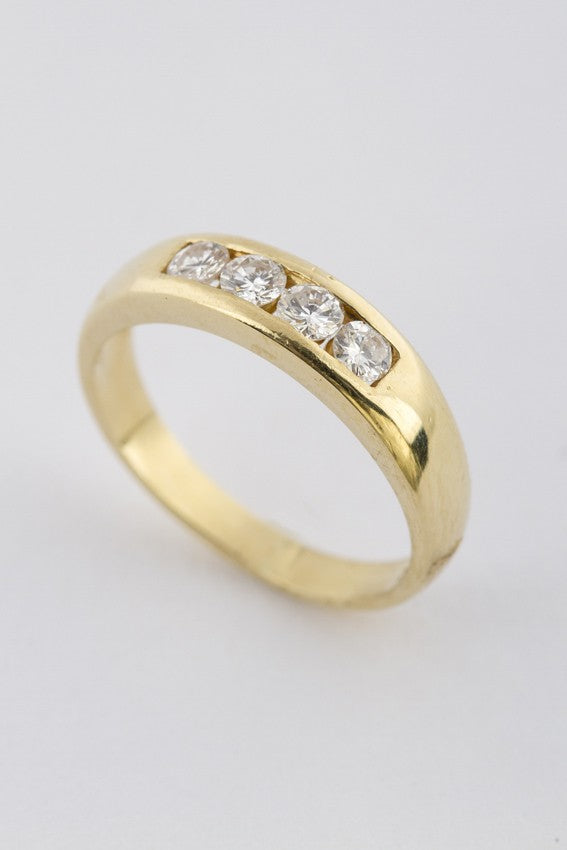 Gold row ring with 4 diamonds