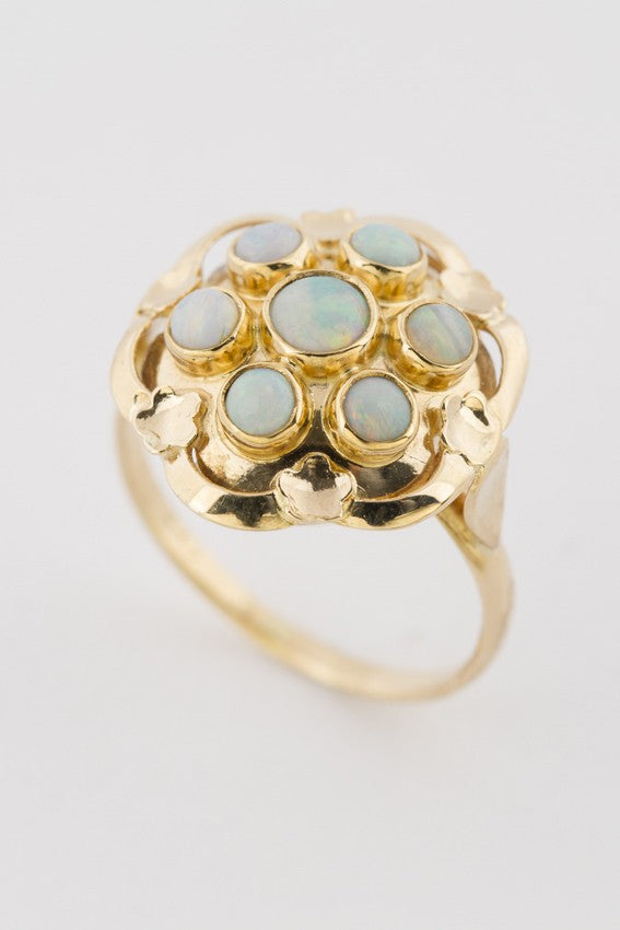 Gold entourage ring with opals