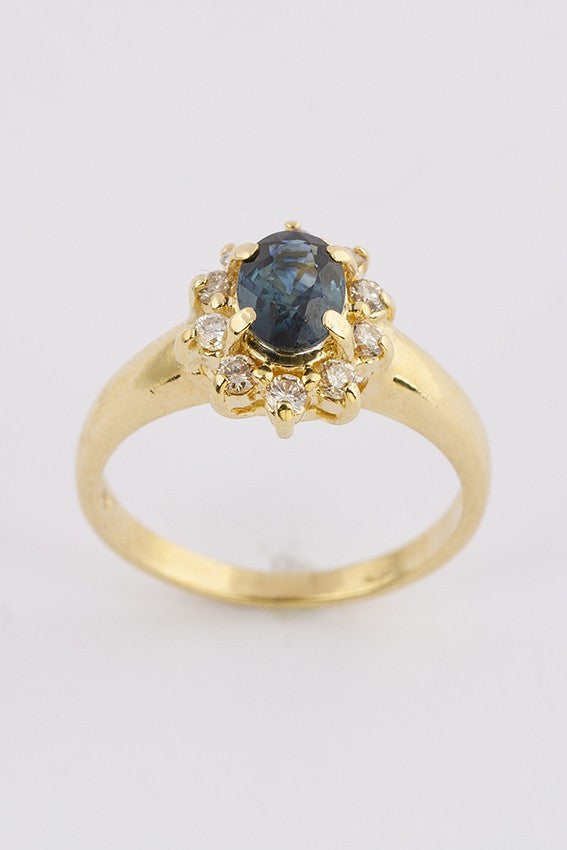 Gouden entourage ring met saffier en briljant