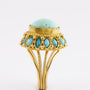 Gouden entourage ring met turkoois