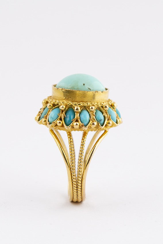 Gouden entourage ring met turkoois