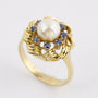 Gouden entourage ring met parel en saffier
