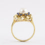 Gouden entourage ring met parel en saffier