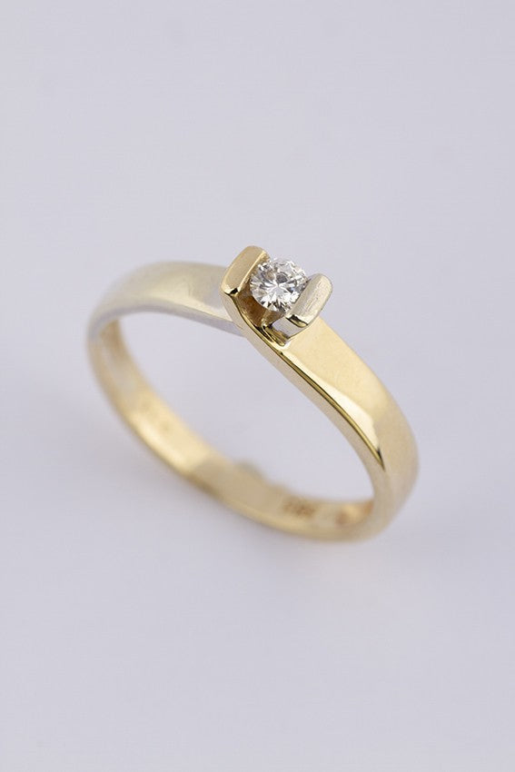 Wit/geel gouden ring met een briljant