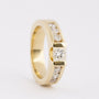 Gold band ring with a princess cut round diamonds