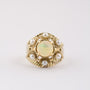 Gouden entourage ring met parels en vuur opaal