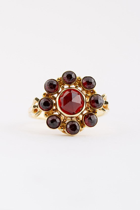 Gouden entourage ring granaat