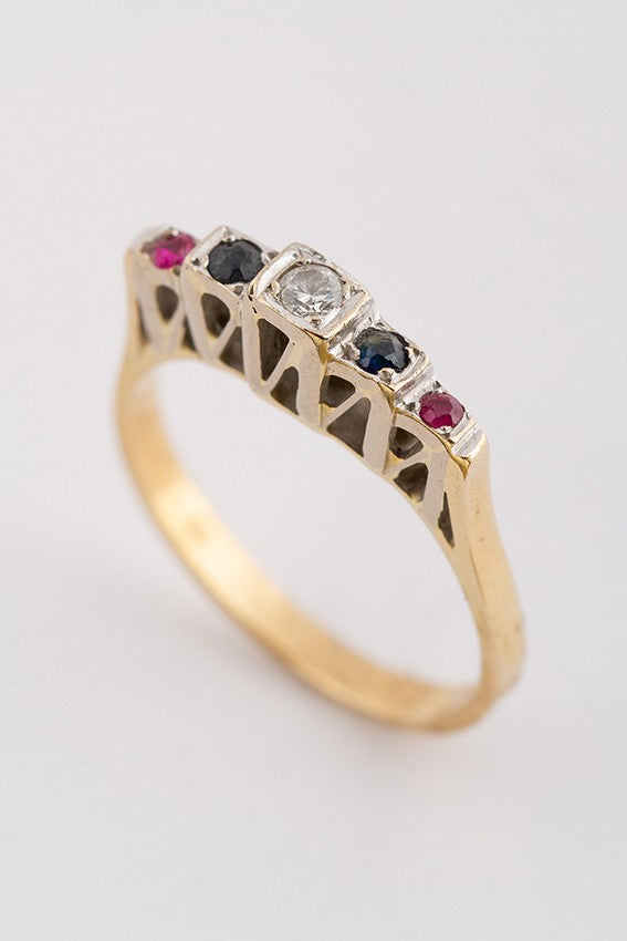 Gold row ring with a brilliant, sapphires and rubies
