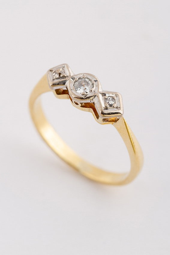 Gold row ring with 3 old-cut diamonds