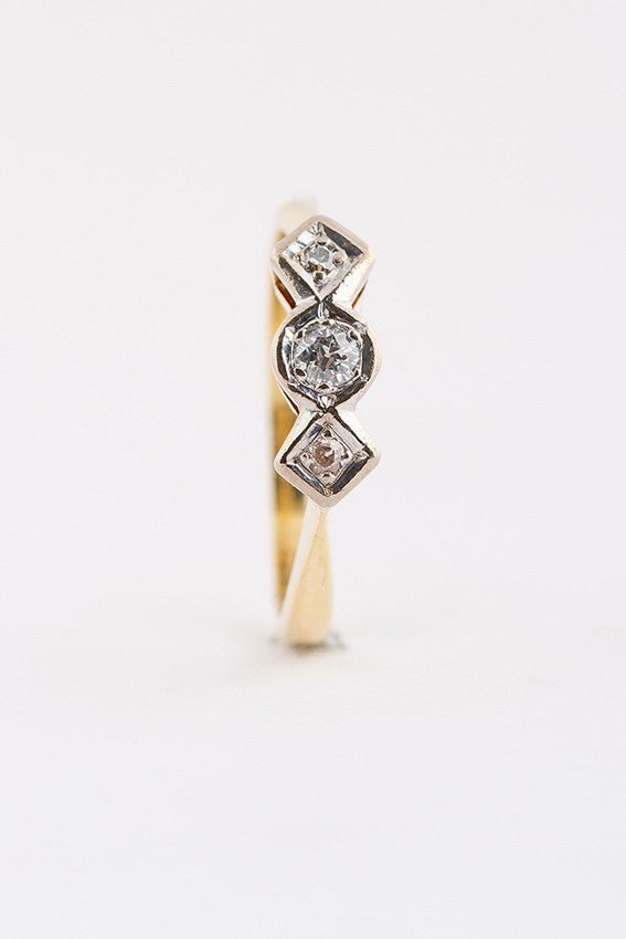 Gold row ring with 3 old-cut diamonds