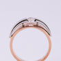 White/rose gold ring with brilliant