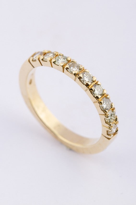 Gold row ring with 9 diamonds