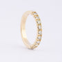 Gold row ring with 9 diamonds