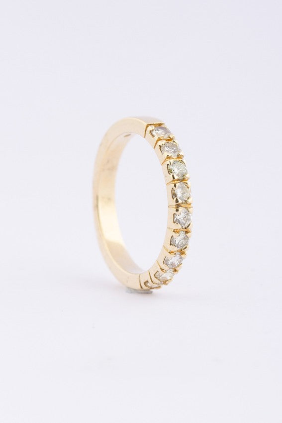 Gold row ring with 9 diamonds