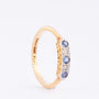 Gold row ring with 3 sapphires and 2 brilliants set in platinum