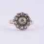 Gold entourage ring with an old-cut brilliant and rose-cut diamonds.